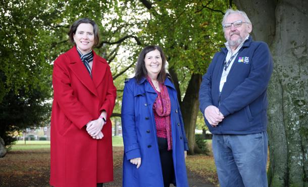 Claire Griffith,  Sasha Deepwell and Ralph Rudden standing on the path next to multiple trees