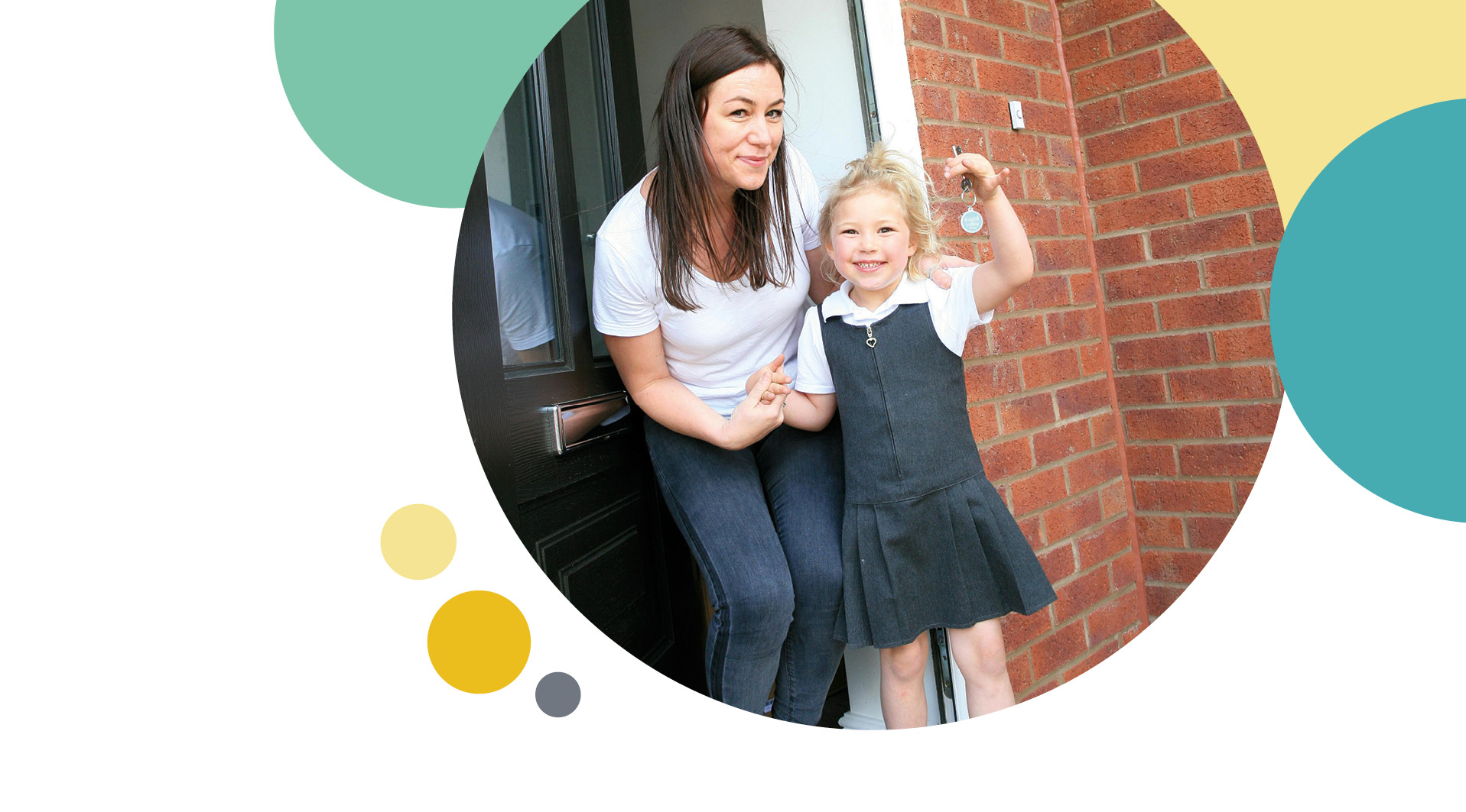 Mother and daughter showing off keys to their new home
