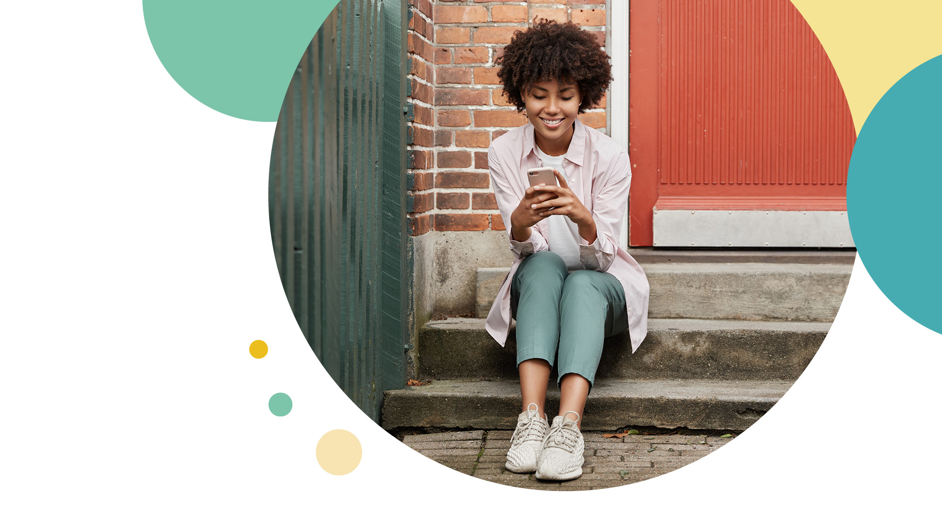Woman sitting on her front doorstep on her phone