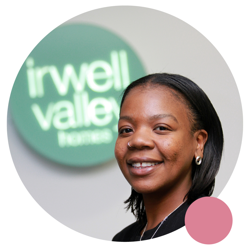 One of our Leasehold team members posing in front of the Irwell Valley Sign