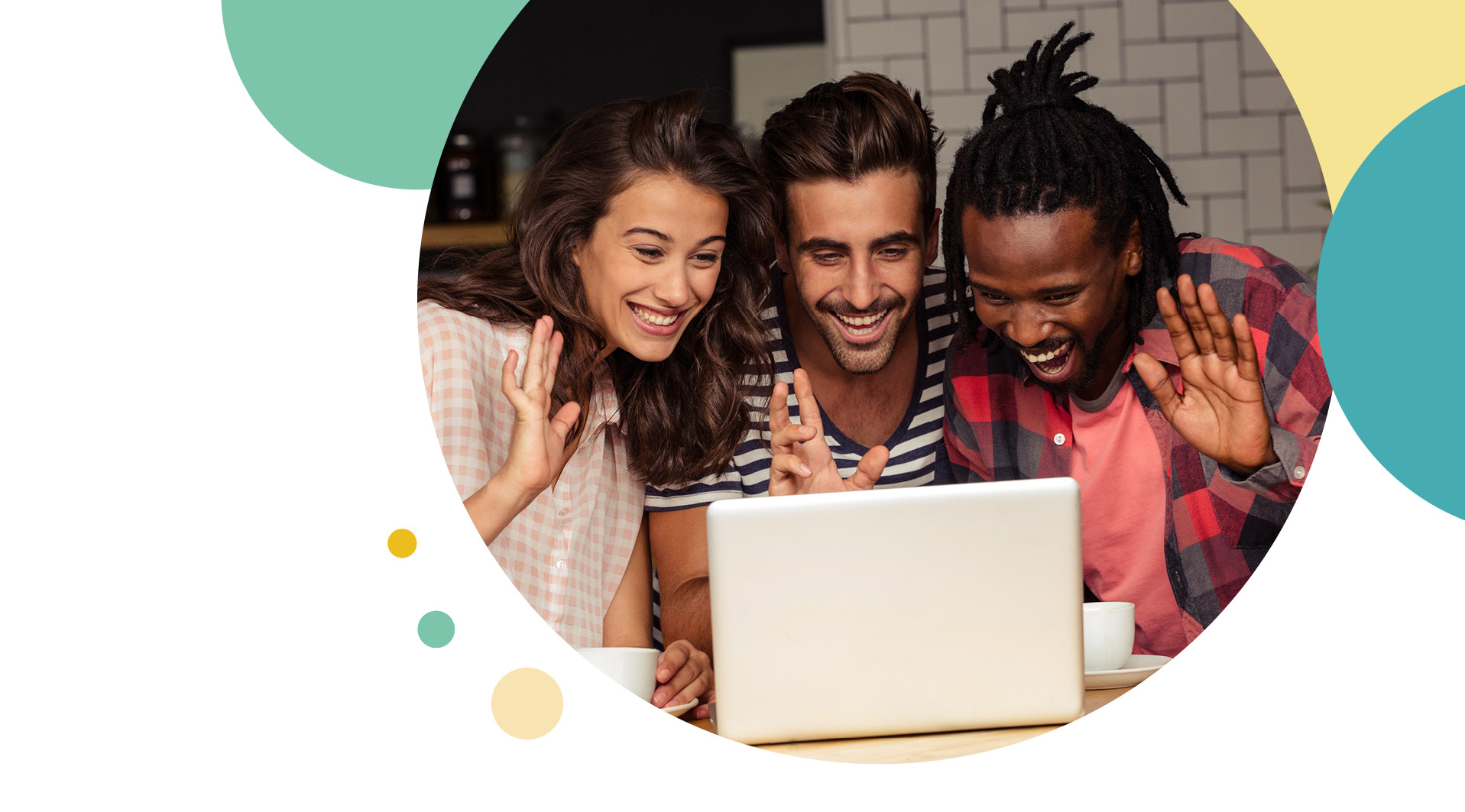 Three people all around a laptop waving to the camera 