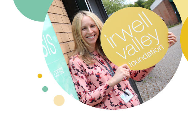 Irwell Valley Employee holding the Irwell valley Logo sign