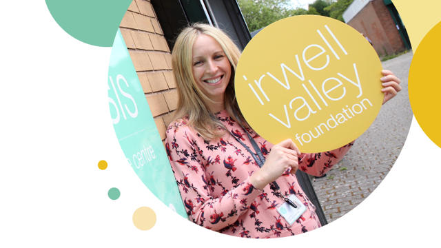 Irwell Valley Employee holding the Irwell valley Logo sign
