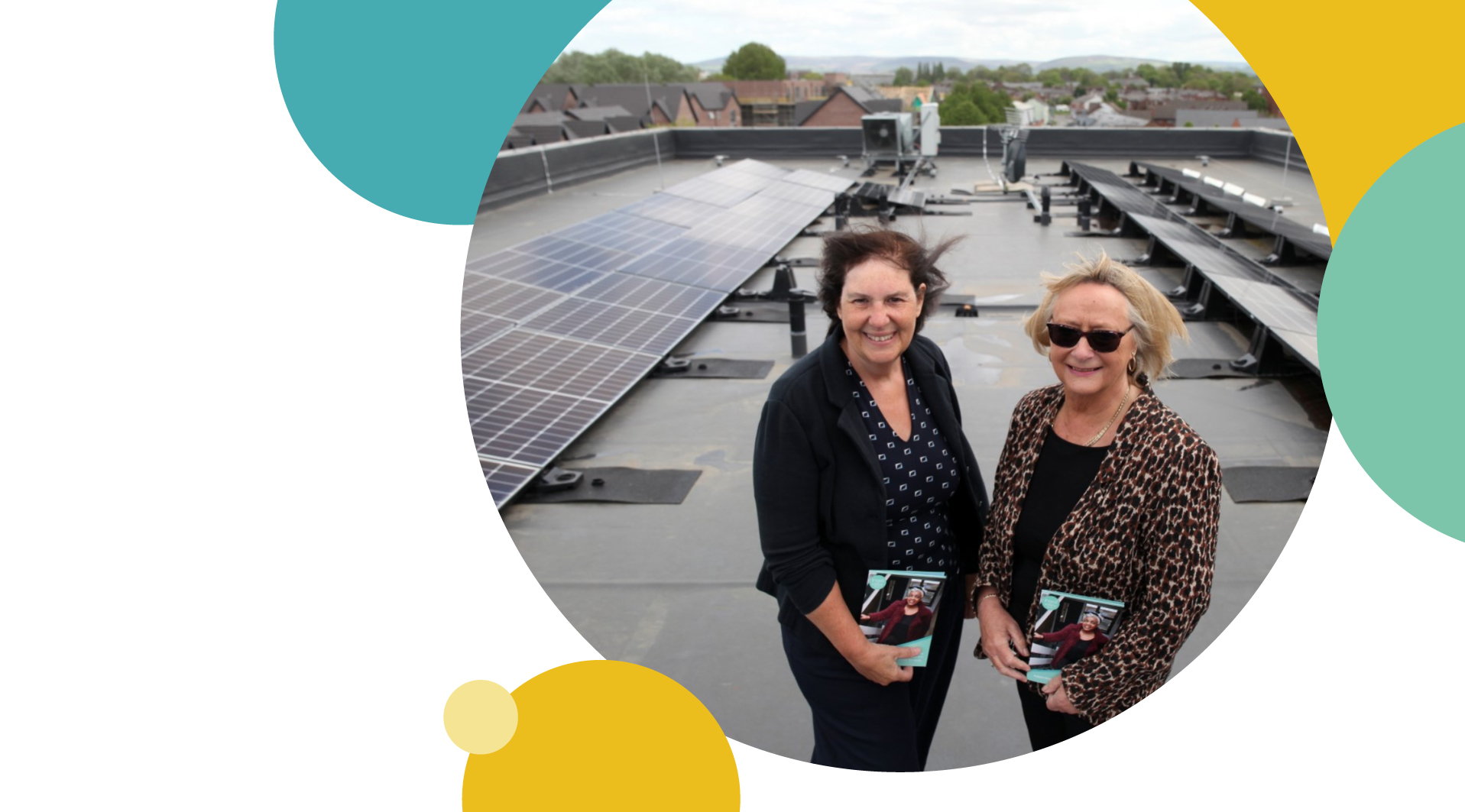 Two Irwell Valley Employees on the roof of our property with Solar Pannels
