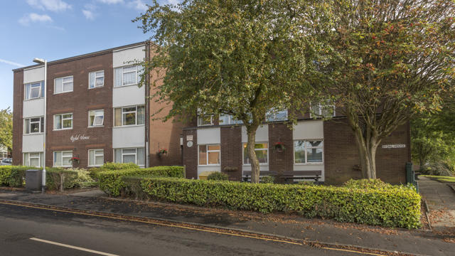 The front of our Rydal property with trees and bushes
