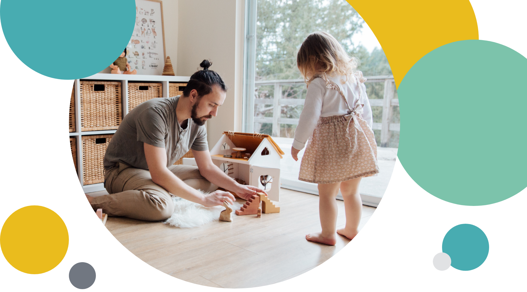 Man and daughter playing with a toy house