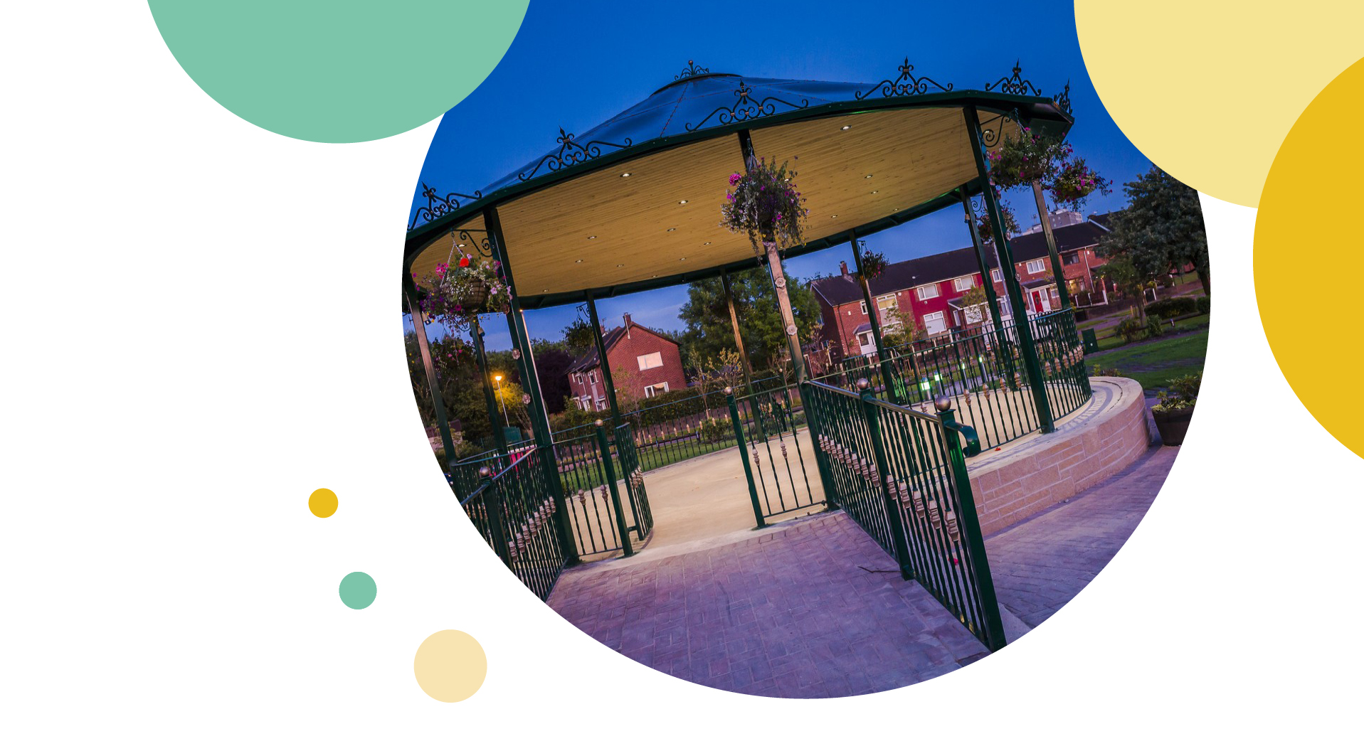 Carousel l in dark lighting with flowers and lights wrapped around it