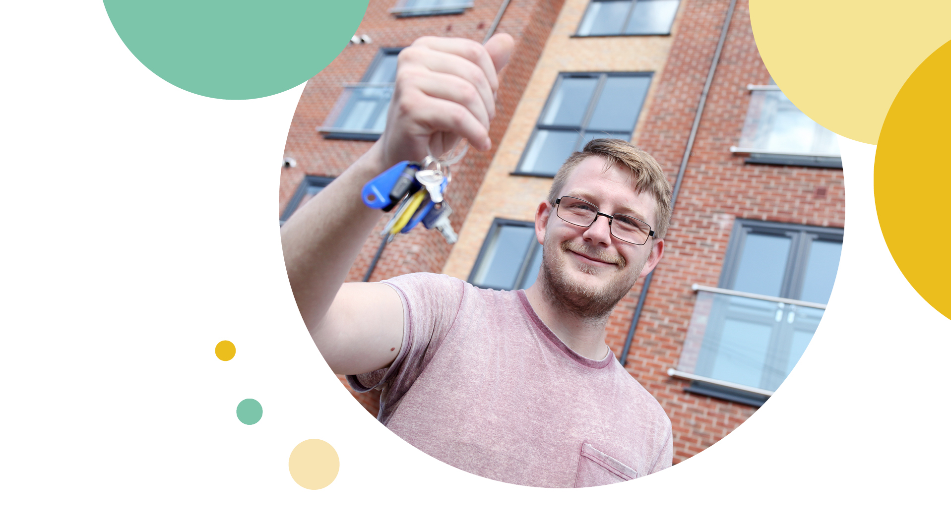 A man showing off the keys to his new property