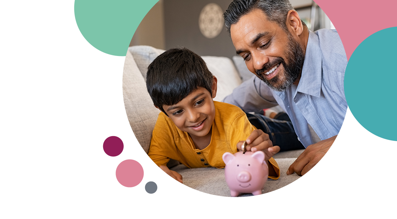A man and his son putting a coin in the piggy bank