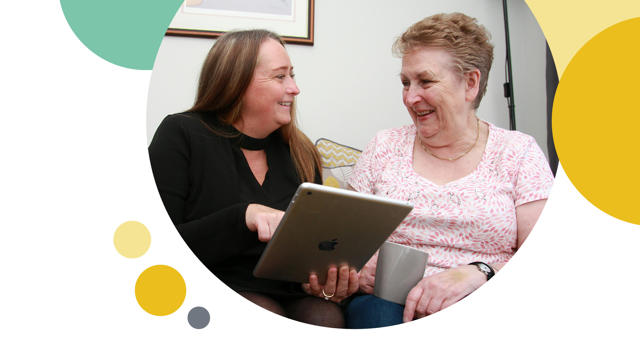 Irwell Valley Employee showing the resident their ipad