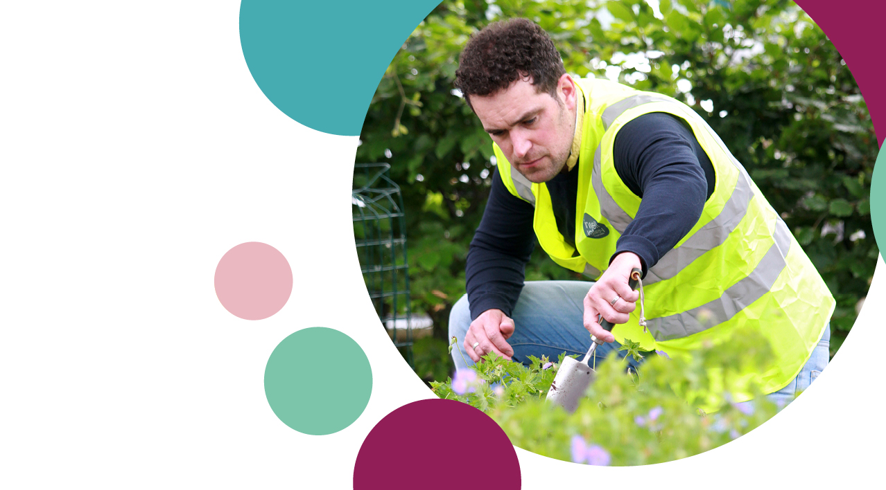 Irwell Valley Employee in Hi vis doing the gardening 