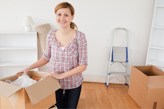 A woman unboxing her things A woman unboxing her things