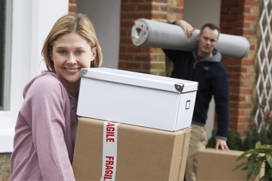 A woman and a man packing their stuff