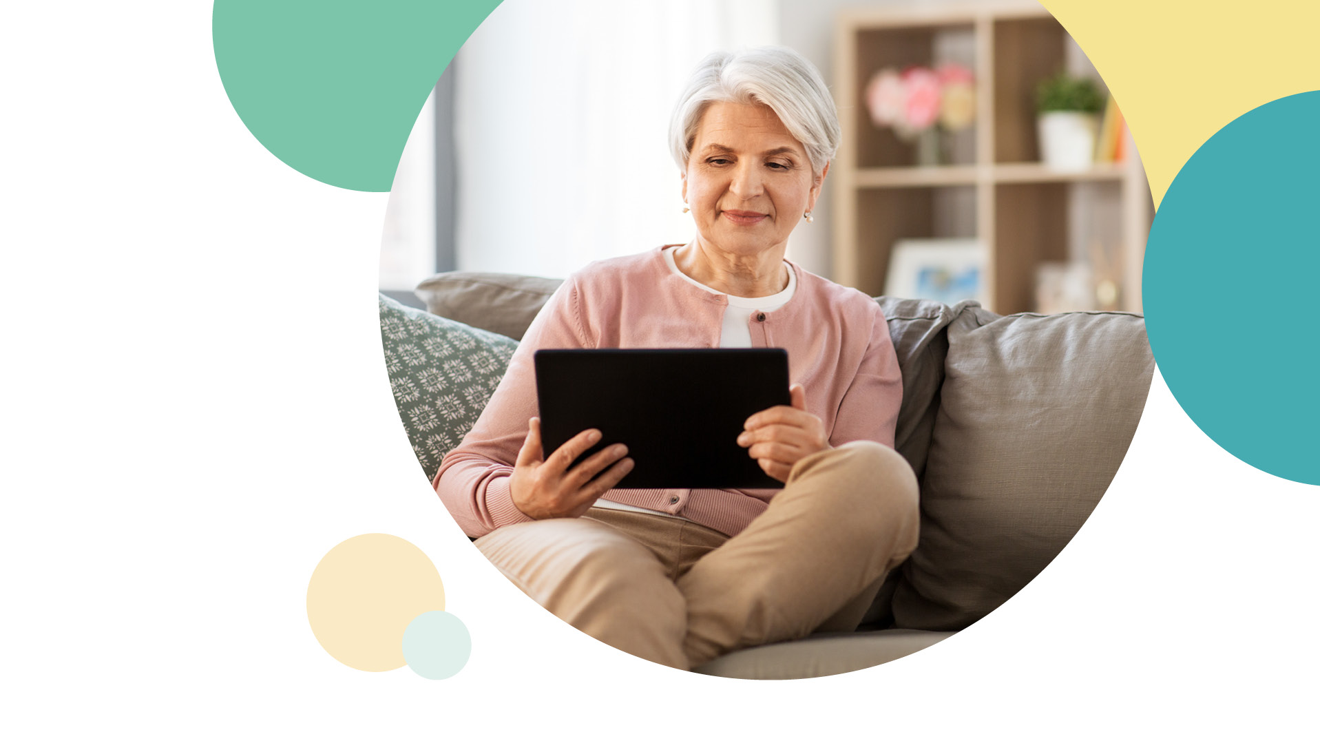 A resident on her ipad sitting on the sofa