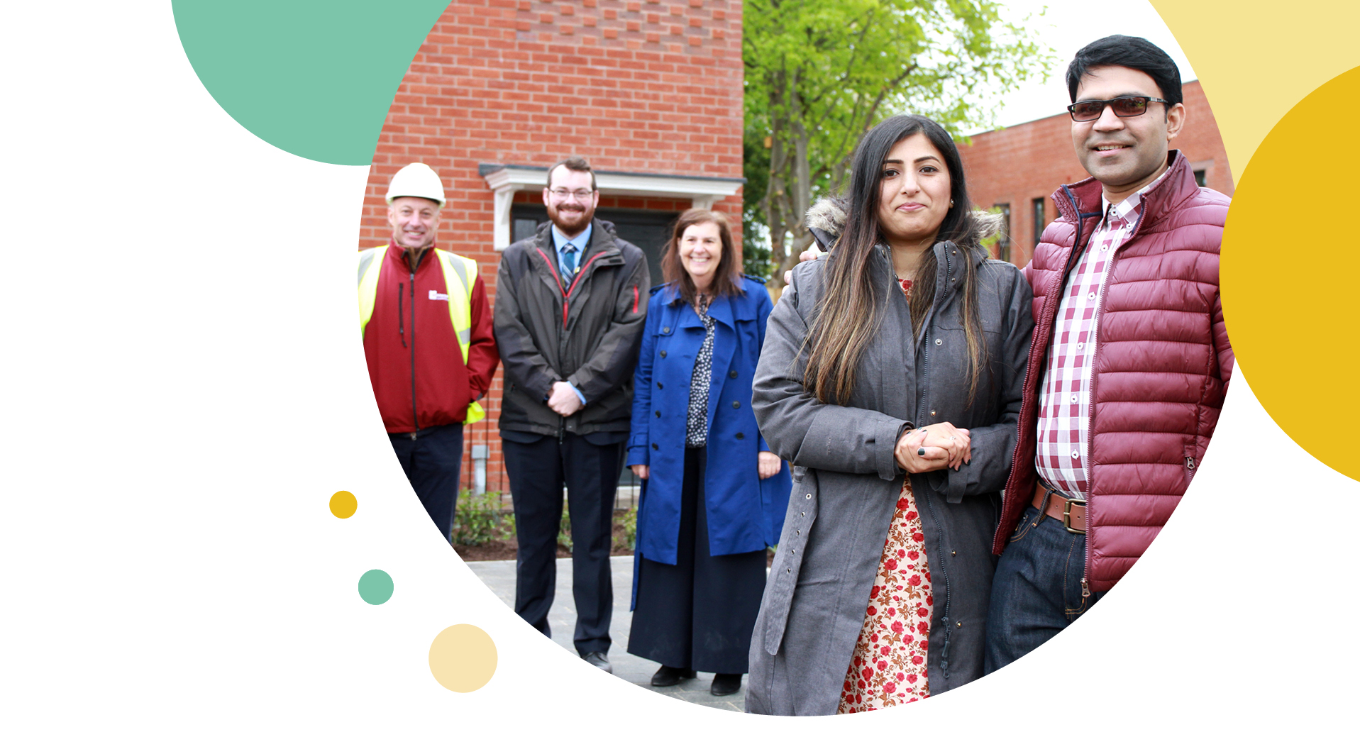 Irwell Valley Homes employees taking a picture with newly moved in residents
