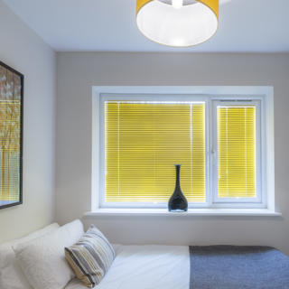 White room with yellow blinds