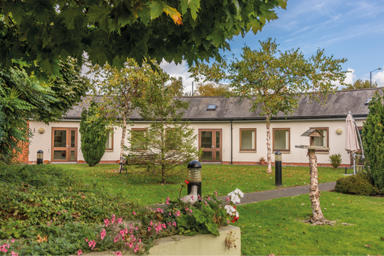 Our property with a flowery garden and blue sky's